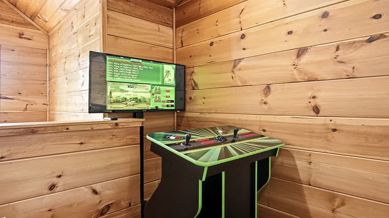 Arcade game machine with two joysticks and a wall-mounted screen