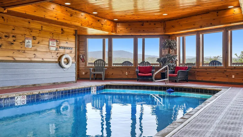 The private indoor pool at Splash Mountain Magic, mountains visible through the windows
